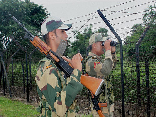 Border Security Force (BSF) personnel keep vigil along the India-Bangladesh Border. PTI Photo.