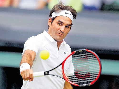 IN CRUISE MODE: Switzerland's Roger Federer returns during his straight sets victory over America's Steve Johnson. AP/pti