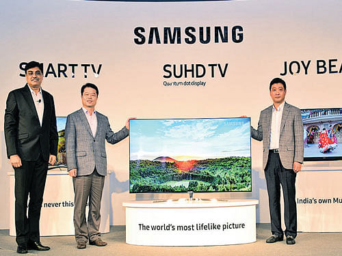 From left: Rajeev Bhutani, VP Consumer Electronics, Samsung India Electronics; H C Hong, President and CEO, Samsung South West Asia and Taeho Park, Senior VP, Samsung India Electronics at the launch in New Delhi on Tuesday.