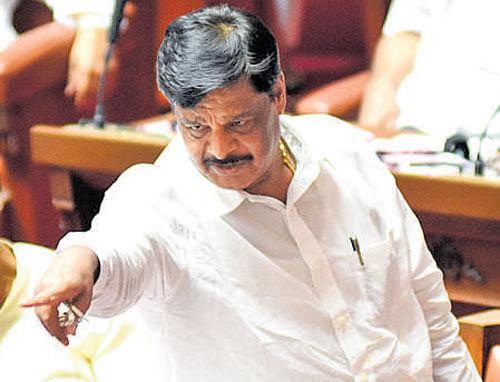 PWD Minister  H C Mahadevappa in a heated argument over sand mining in the Legislative Council on Tuesday. DH PHOTO