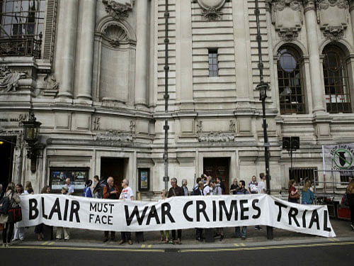Demonstrators protest before the release of the John Chilcot report into the Iraq war, at the Queen Elizabeth II centre in London. Reuters photo