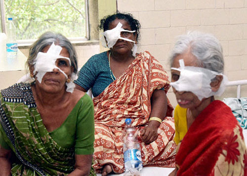 Three of the thirteen eye patients who underwent catract surgery at a hospital in Hyderabad on Wednesday. Seven patients are in danger of losing vision as a solution used during surgeries was found contaminated. PTI Photo
