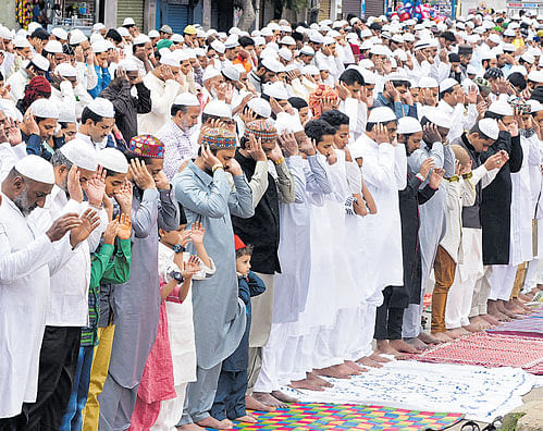 Festive fervour: (Clockwise) Muslims offer prayers on the occasion of Eid-ul-Fitr at Quddus Saheb Idgah Maidan on  Thursday. DH Photo