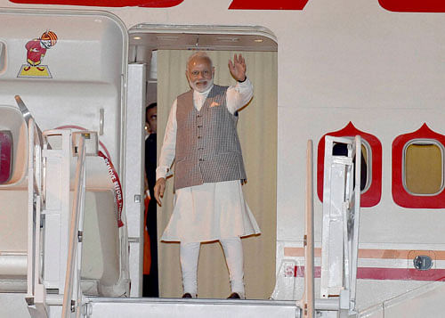 Prime Minister Narendra Modi waves during his departure from Maputo International Airport in Mozambique on Thursday. PTI Photo