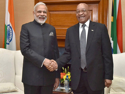 Prime Minister Narendra Modi shakes hands with South African President Jacob Zuma at a meeting at Union Buildings in Pretoria in South Africa on Friday. PTI Photo