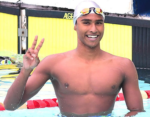 Winning sign: Sanjay C J won five individual gold medals and set three national records at the Junior National Aquatic Championships. DH Photo/ Kishor Kumar Bolar