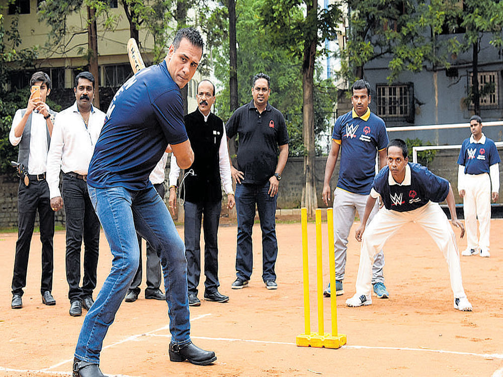 Members of the Special Olympics Bharat team play cricket with World Wrestling Entertainment heavyweight champion Alberto Del Rio in the city on Saturday. DH photo