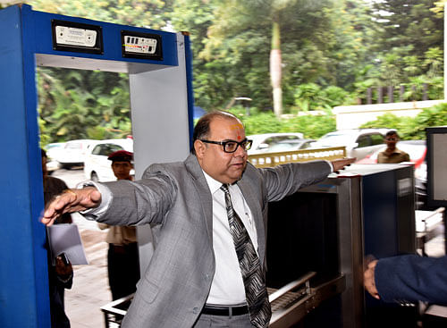 High Court Chief Justice Subharo Kamal Mukherjee goes through a security check at the venue of the Southern State Bar Councillors' Meet organised by Karnataka State Bar Council in Bengaluru on Saturday. DH PHOTO/ M S Manjunath