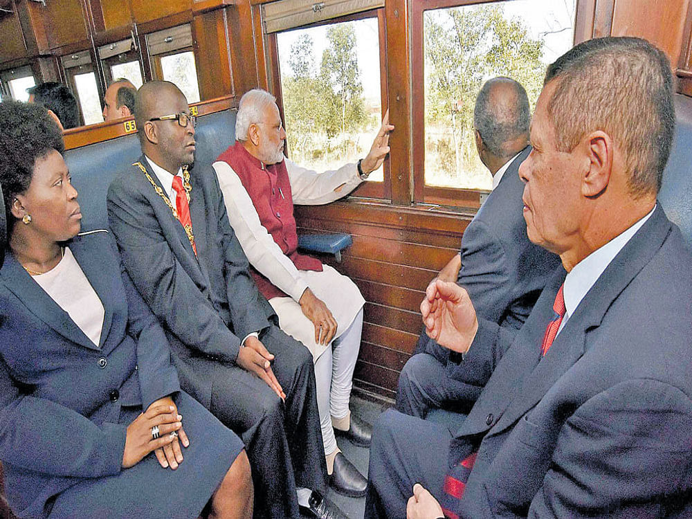 Narendra Modi travels by train from Pentrich Railway Station to Pietermaritzburg, in South Africa on Saturday. PTI