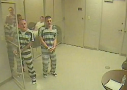 The inmates kept screaming for help and started banging on doors in a desperate bid to get someone down to the cell. Video grab