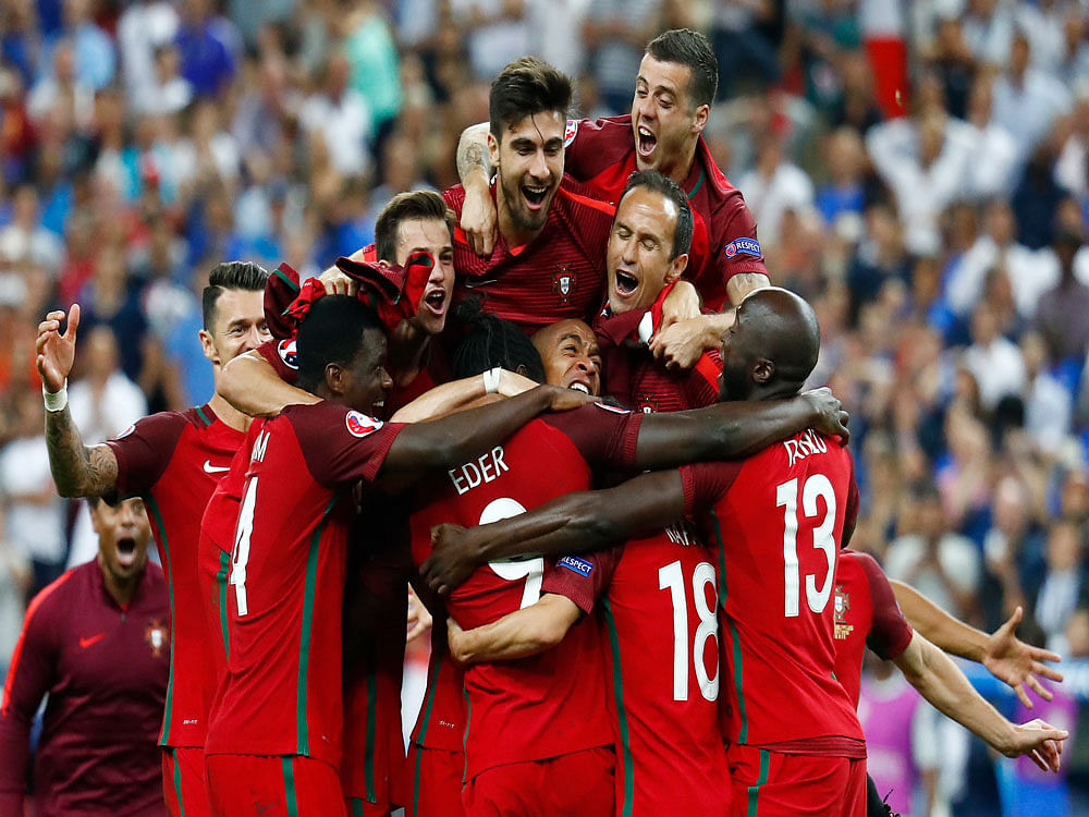 Portugal players celebrate their 1-0 win over France in the Euro 2016 final at the Stade de France. Reuters