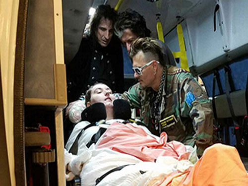 Before the show, the 53-year-old actor and his bandmates, Alice Cooper and Joe Perry, met their fan inside her ambulance. Image courtesy Twitter.