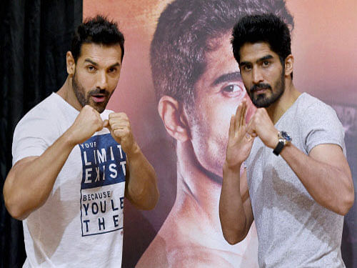 Bollywood actor John Abraham and boxer Vijender Singh during a promotional event in Mumbai on Wednesday. PTI Photo