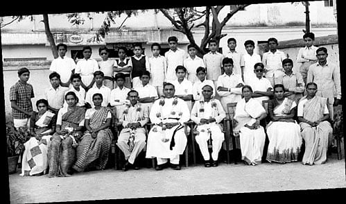 (Sitting from left) The author, Victoria, Charlette Samuel, Prakash, Principal Rev J D Wilfred, Yesupatham, Rose Sugirtham, Saroja and Paripurnam with the high school students.