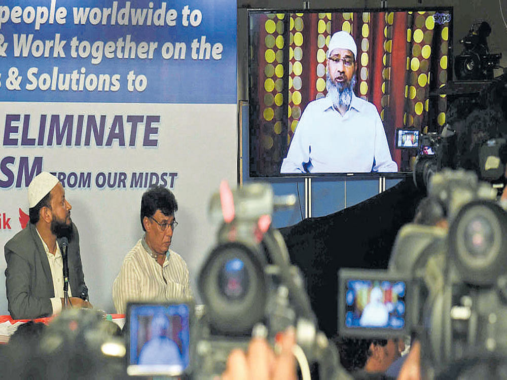 Zakir Naik addresses the media through Skype. DH photo