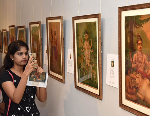 Visitors at the exhibition titled Raja Ravi Varma Royal Lithography and Legacy at National Gallery of Modren Art in Bengaluru.