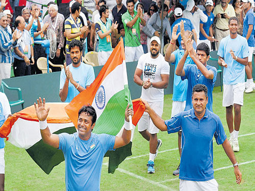 cheer leader: Leander Paes (front left) leads India's celebrations after he and Rohan Bopanna gave India an unbeatable 3-0 against South Korea in Chandigarh on Saturday. PTI