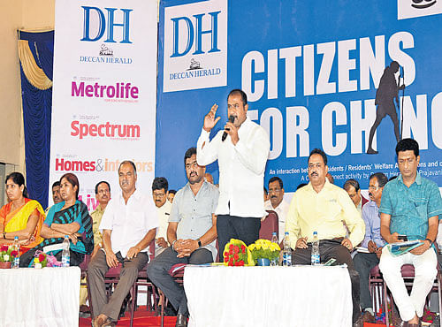 Satish Reddy, MLA, speaks at the Citizens for Change, an interaction programme organised by Deccan Herald and Prajavani at Bommanahalli constituency on Saturday. Corporators R Prabhavati Ramesh, BM Shobha Muniramu, Gurumurthy Reddy, K Narayan Raju, joint director,BBMP, NMuniraju and C R Rammohan Raju, corporator, are seen. DH PHOTO