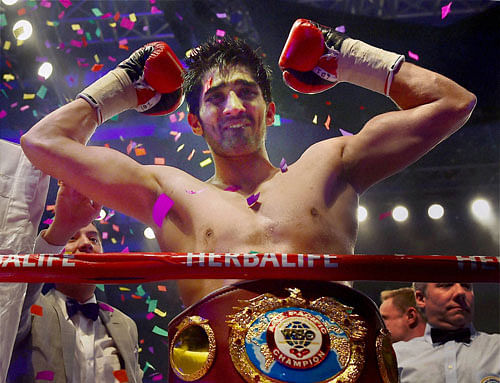 Vijender Singh celebrates after beating Australia's Kerry Hope to win the WBO Asia Pacific Super Middleweight Championship at Thyagaraj Sports Complex in New Delhi on Saturday. PTI Photo