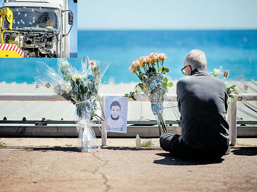 innocent victim: A portrait of Yanis Coviaux, who was killed when a man drove a 19-tonne truck (seen in the inset with bullet holes) through a crowd celebrating Bastille Day at the Promenade des Anglais in Nice, France on July 16, 2016. nyt