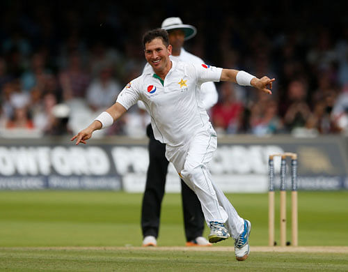 Pakistan's Yasir Shah celebrates taking the wicket of England's Moeen Ali. Reuters