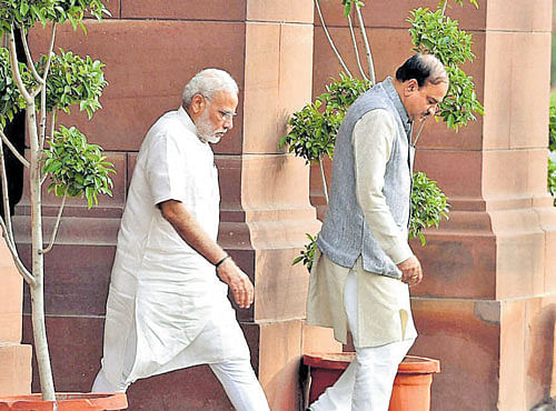 Prime Minister Narendra Modi and Parliamentary Affairs Minister Ananth Kumar arrive to attend the BJP Parliamentary Party's executive meeting. PTI