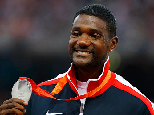 POWERING AHEAD Justin Gatlin celebrates after winning the 200M final during the US Olympic trials. Reuters