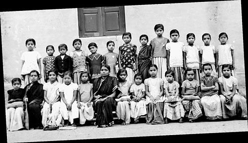(Sitting, from left) Gowramma, Ganga, Bassamma (fourth), Bala, Puttamma (teacher), Arokya Mari, Chikki, Ratna (10th),  Mahadevi, the author and Putti. (Standing) Kamala, Sidamma, Rangamma (5th), Susheela, Bhagya (8th), Prabha,  Gopalamma and Putta Gowri (13th).