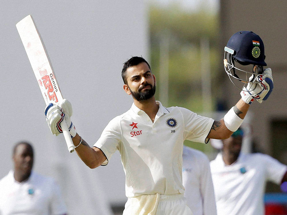 Kohli returned to the Caribbean after five years and got down to business, scoring his maiden 200 in the very first innings of the opening Test match against the West Indies here. AP/PTI photo