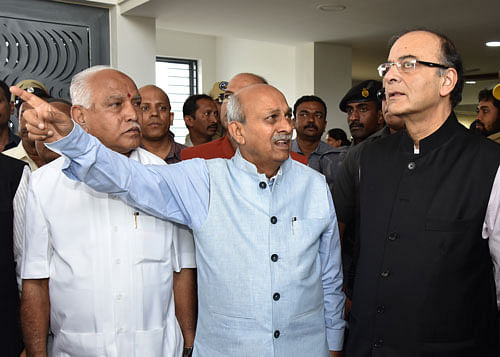 KLE Society Chaiman Dr Prabhakar B Kore gives explanation of the KLE Society to Union Finance and Corporate Affairs Minister Arun Jaitley at the inaugural of the new building of KLE Society's Law College at Vishveshwaraiah BDA Layout in Bengaluru on Saturday. BJP State President B S Yeddyurappa is also seen. DH Photo