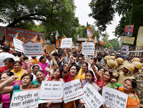 BJP women wing protests against BSP General Secretary Naseemuddin Siddiqui outside district court over his comments against expelled BJP leader Dayashankar Singh's family members, in Lucknow on Saturday. PTI Photo
