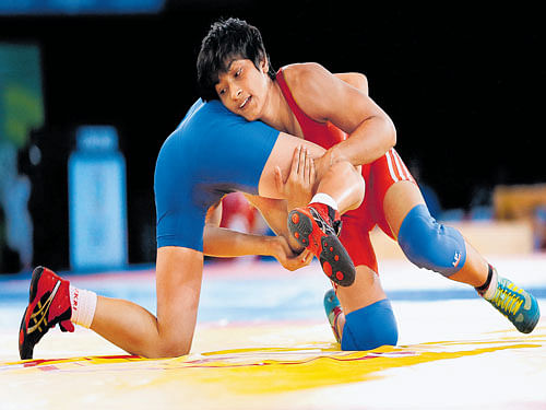 the 'dabang' girl : Vinesh Phogat (right) is keen to chart a new path for women wrestlers in the country with a successful showing at the Rio Olympic Games.