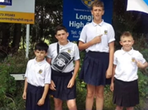 Four boys at the Longhill High School, in Brighton, East Sussex, wore skirts to school in protest after they were pulled up for wearing shorts. Video grab