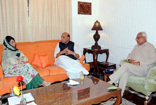 Union Home Minister Rajnath Singh with Governor of J&K N N Vohra and Chief Minister Mehbooba Mufti during their meeting in Srinagar on Saturday. PTI photo