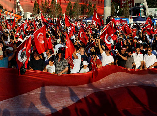 Supporters of the Republican People's Party, or CHP, wave Turkish flags during a 'Republic and Democracy Rally' at Taksim square in central Istanbul, Sunday, July 24, 2016. Thousands of supporters of Turkey's main opposition group and some ruling party members rallied in Istanbul to denounce a July 15 coup attempt, a rare show of political unity that belied opposition unease over President Recep Tayyip Erdogan's crackdown since the failed uprising.AP/PTI