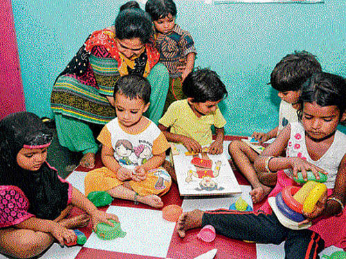 Children engaged in different activities at anganwadi number 1 . DH photo/Chaman Gautam
