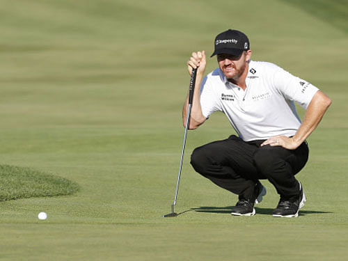 PGA golfer Jimmy Walker lines up a putt on the tenth hole during the first round of the 2016 PGA Championship golf tournament at Baltusrol GC - Lower Course. Reuters Photo.