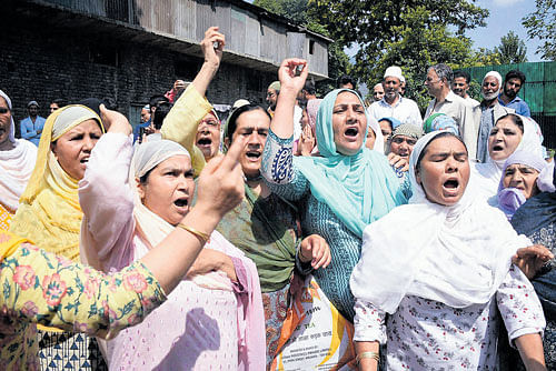 NO respite: Women shout slogans during a protest outside the office of United Nations Military Observer Group in India and Pakistan, at Sonawar in Srinagar on Friday. PTI