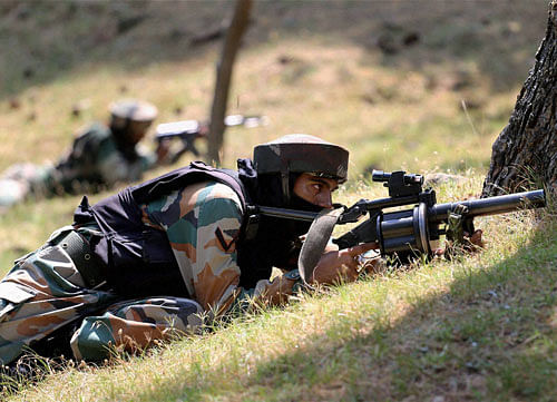 Army personnel take position at Nowgam Sector along the LoC on Saturday. PTI