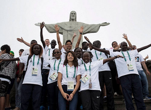 Members of the Refugee Olympic Team pose for a photo in front of the Christ the Redeemer statue in Rio de Janeiro, Brazil, Saturday, July 30, 2016. A group of 10 athletes from South Sudan, Syria, Congo and Ethiopia will compete in Rio under the Olympic flag. AP/PTI