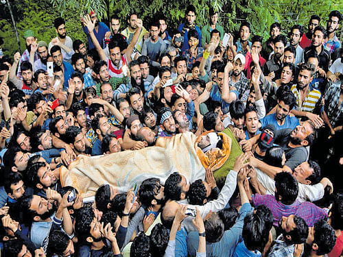 bidding farewell: Villagers carrying the body of Burhan Wani during his funeral procession in Tral, east of Srinagar, in Kashmir. Protests erupted on the day of the funeral and were repressed by troops with indiscriminate force, including pellet guns. nyt