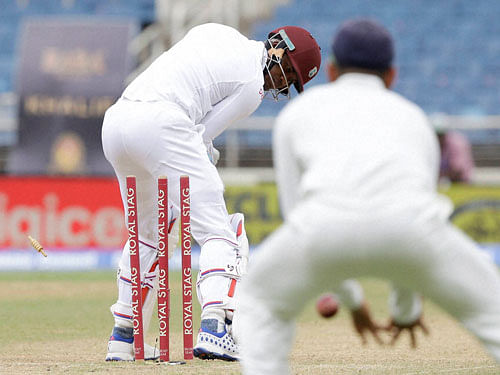 West Indies' batsman Marlon Samuels is bowled by India's Mohammed Shami during day four of their second cricket Test match at the Sabina Park Cricket Ground in Kingston, Jamaica, Tuesday, Aug. 2, 2016.AP/PTI Photo