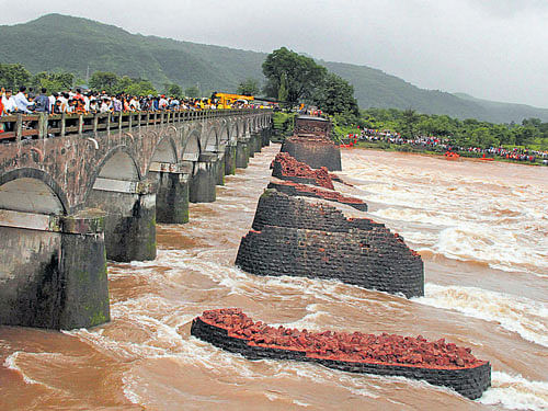Damage: The Mahad-Poladpur bridge was washed away by the floodwaters of Savitri river on the Mumbai-Goa highway in Raigad district on Wednesday. DH Photo