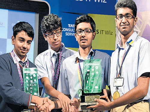 Samarth D Raju and Suketh K S of Presidency School, Nandini Layout (right), who won first prize in the regional edition of 'IT Wiz' annual inter-school IT quiz organised by Tata Consultancy Services (TCS), greet  second prize winners Mohit Doshi and Vallabh Ramakanth of Sri Kumaran's Children's Home  in Bengaluru on Thursday. DH photo