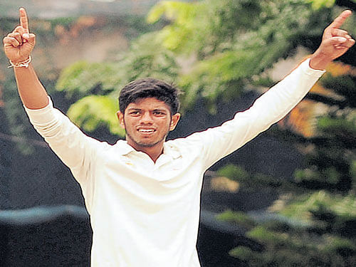 wrecker-in-chief: Jaydev Patel of Baroda Cricket Association celebrates after taking his eighth wicket against  President's XI in Bengaluru on Saturday.  DH PHOTO