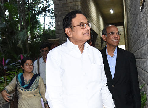 Former finance minister P Chidambaram and former RBI  Governor D Subbarao arrive for a panel discussion at IIM-B on Sunday.