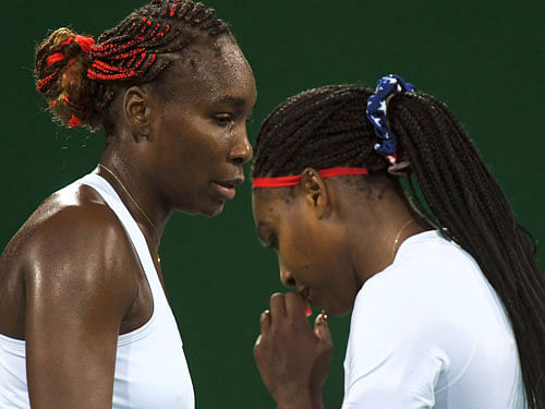 Serena Williams (USA) of USA and Venus Williams (USA) of USA are seen during their match against Lucie Safarova (CZE) of Czech Republic and Barbora Strycova (CZE) of Czech Republic. REUTERS
