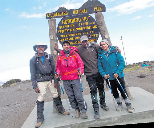 excited The author (fourth) with her friends Prosper, Anita and Frank at the last camp Horombo hut.