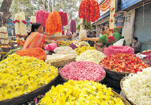 colourful The markets are flooded with different kinds of flowers for 'Varamahalakshmi'. DH PHOTO BY SRIKANTA SHARMA R
