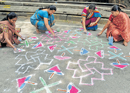 good tidings 'Rangolis' are said to bring in good luck, wealth and prosperity. dh photo by Ranju P